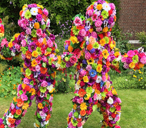 FLOWER PEOPLE TO HIRE - BLOSSOM IN HUGS FUN WALKABOUT FLORAL ACT