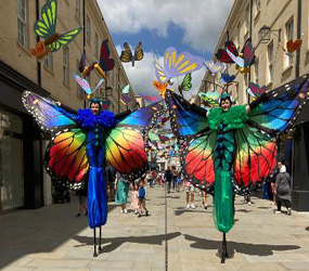 Butterfly stilt walkers to hire - Festival themed entertainment