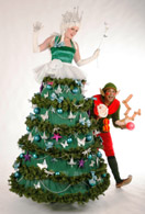 Christmas Party Entertainment: The Chrismas Tree Stilt with her cheeky balloon modeller