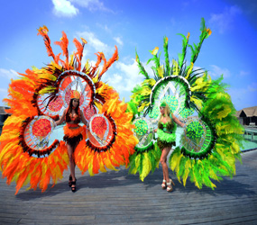 RIO CARNIVAL WALKABOUT ACTS- LAVISH FEATHER SHOWGIRLS -HIRE PARADES EVENTS UK