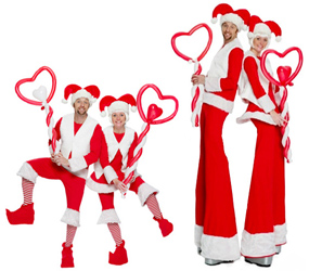 CHRISTMAS PARTY ENTERTAINMENT TO HIRE- MR & MRS SANTA STILTS AND ELF BALLOON MODELLERS BIRMINGHAM AND MANCHESTER AND LONDON 