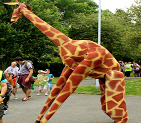 lion king themed entertainment - giraffe stilt walkers UK