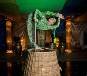 ARABIAN NIGHTS THEMED SNAKE PERFORMER - ACROBAT IN A BASKET STAGED ACT HIRE