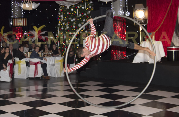 CHRISTMAS PARTY ENTERTAINMENT TO HIRE - CANDY STRIPE ACROBAT ON WHEEL - STAGED CHRISTMAS PARTY ACTS UK
